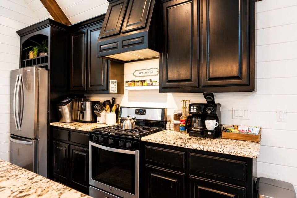 Modern chef’s kitchen with granite counters, stainless appliances, and a premium