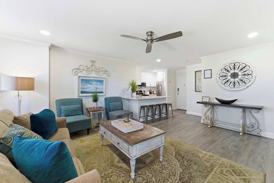Bright living area with sofa sleeper, Smart TV, and views of downtown