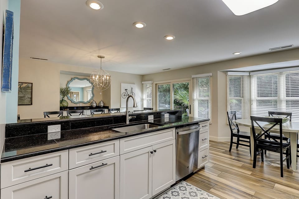 Fully stocked kitchen with all stainless steel appliances.