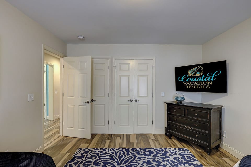 Bedroom 1 - 2 twin beds featuring a flatscreen tv.