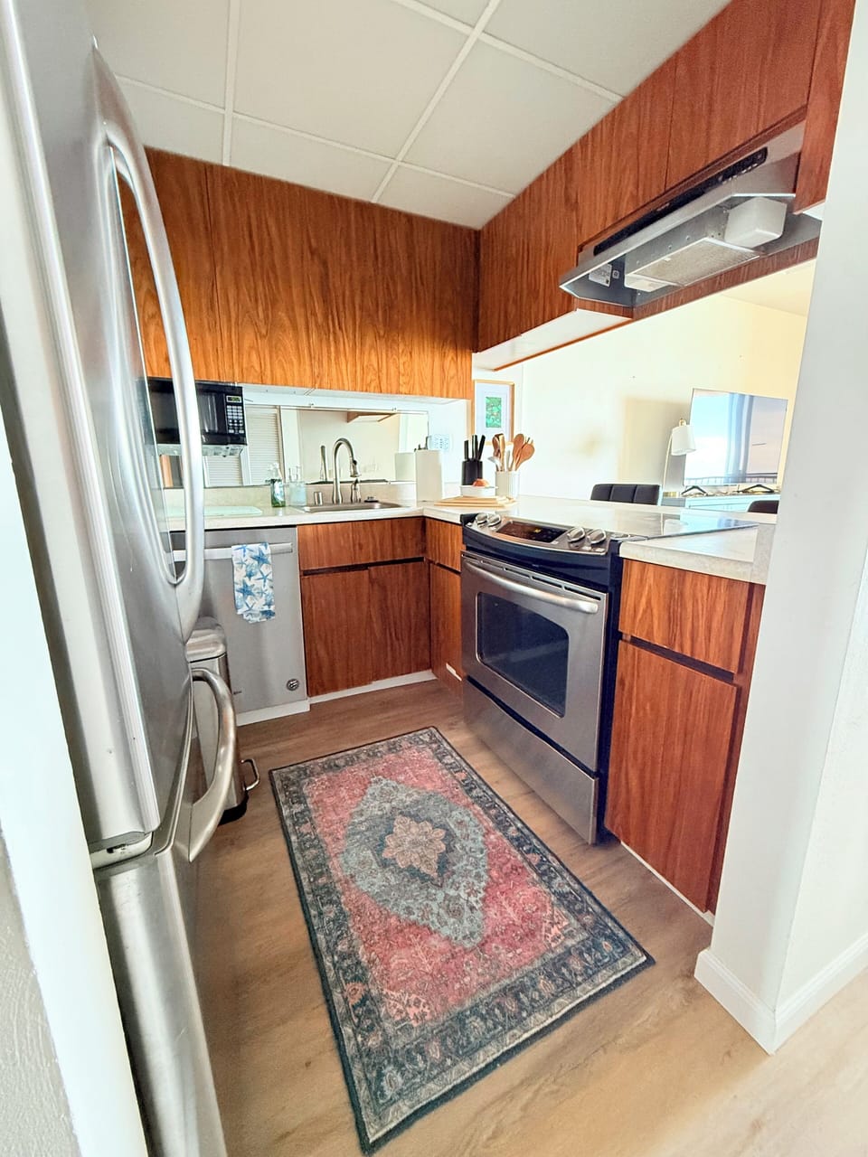 kitchen view. there are two barstools on the other side of the counter