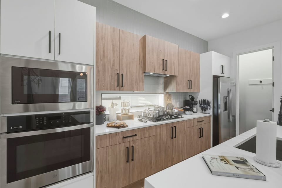 A bright and functional kitchen equipped with the essentials for easy meal prep. Guests have access to a microwave, fridge, coffee maker, and basic dishware, making it simple to enjoy meals during your stay. Clean, organized, and convenient.