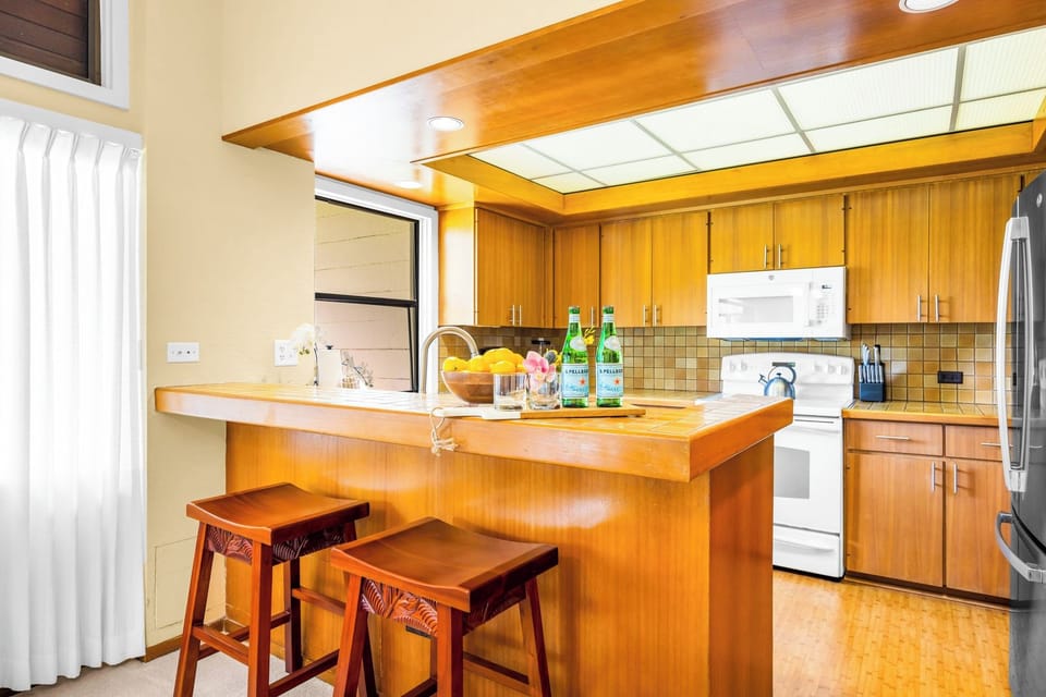 Bar seating bridges the kitchen and living areas for easy breakfasts and quick bites. KRV-2121
