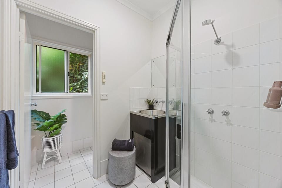 Private bathroom with separate toilet, shower and basin
