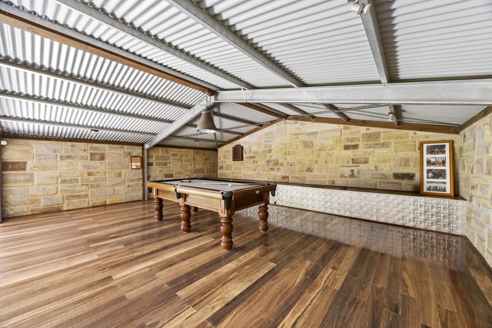 Games loft with pool table overlooking pool