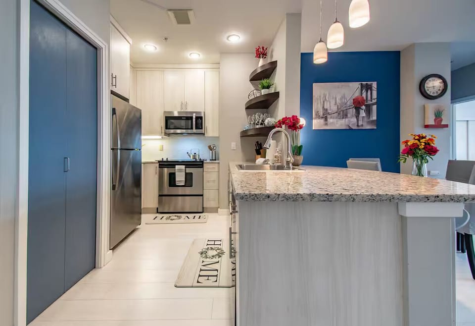 Luxurious kitchen & in-unit laundry (located behind blue doors)