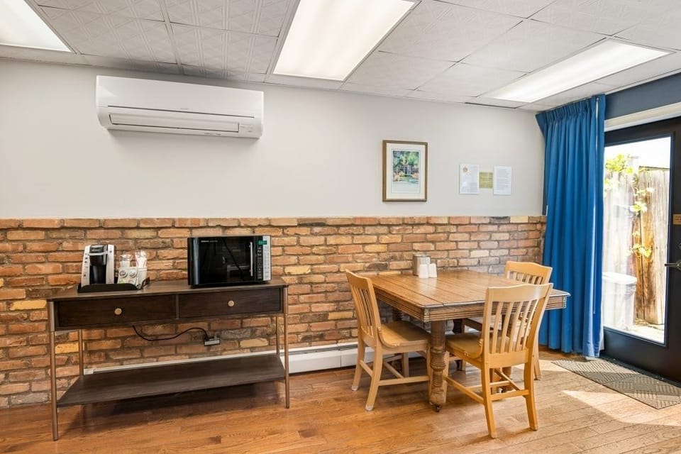Gather for meals and games at the cozy dining table.