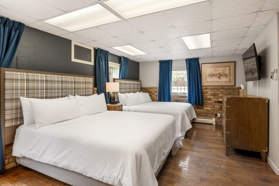 Unwind on crisp linens in a bright, spacious bedroom.