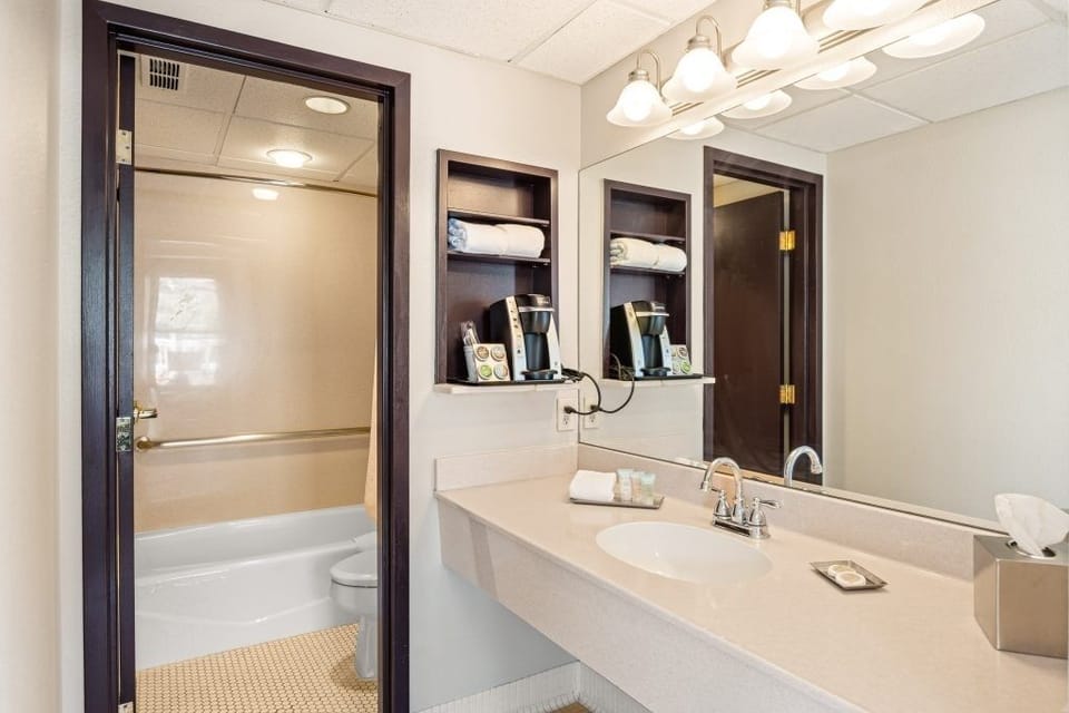 Refresh easily with a wide vanity and bright mirror lighting.