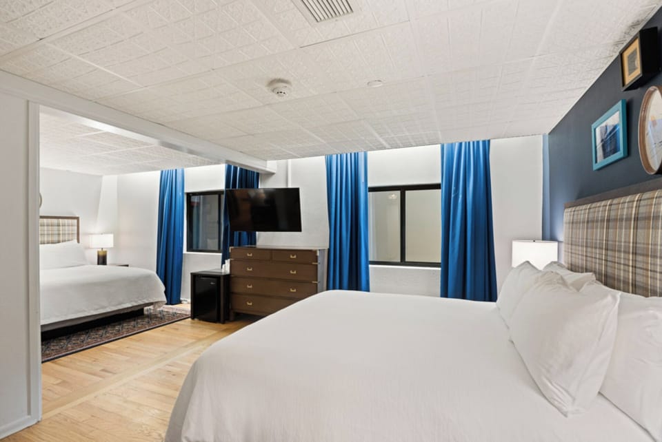 Unwind in crisp linens with a calming, spacious layout.