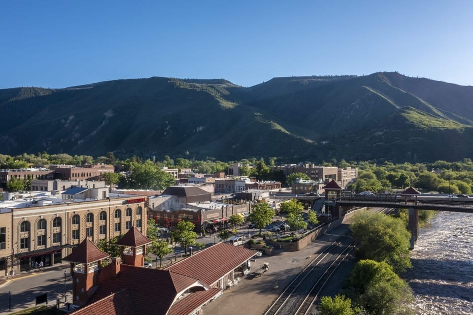Stroll lively streets framed by glowing mountains and river breezes.