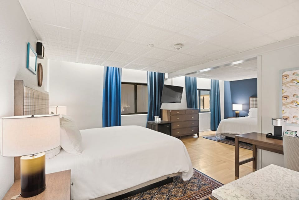 Recharge in a serene bedroom with bold, cozy accents.