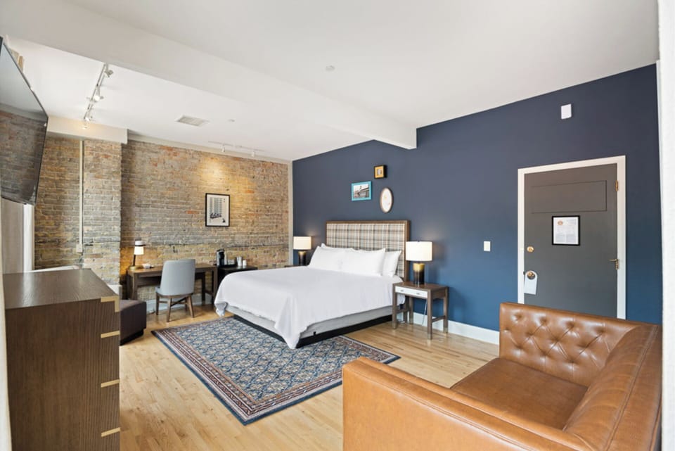 Stretch out in a stylish room with exposed-brick charm.