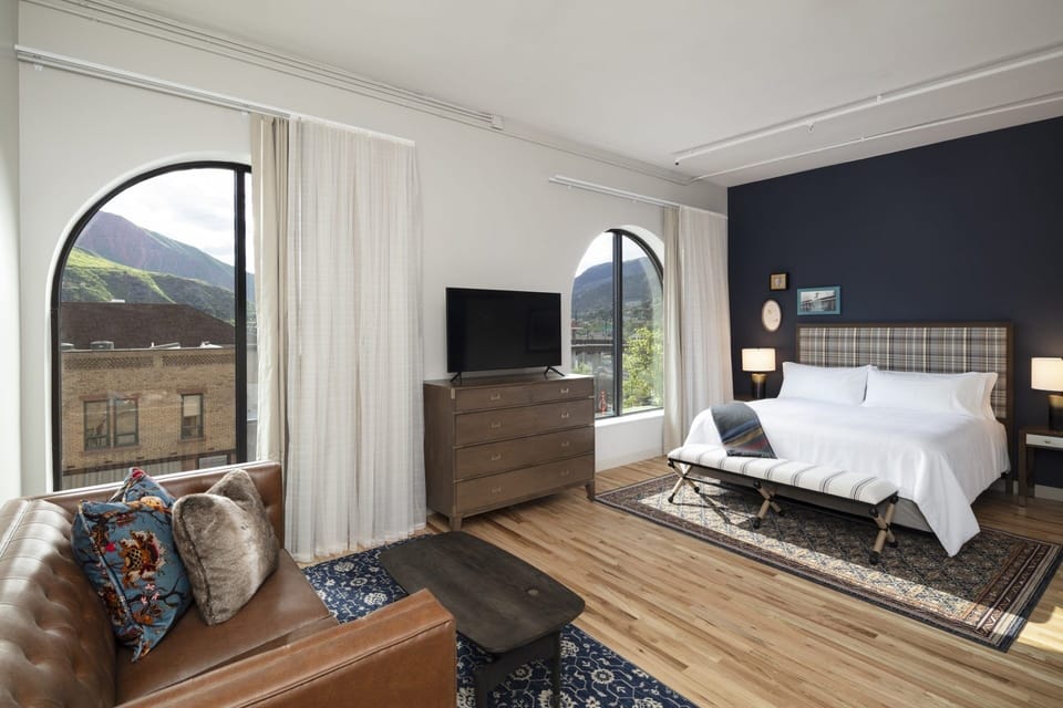 Wake up to mountain views through soaring arched windows.
