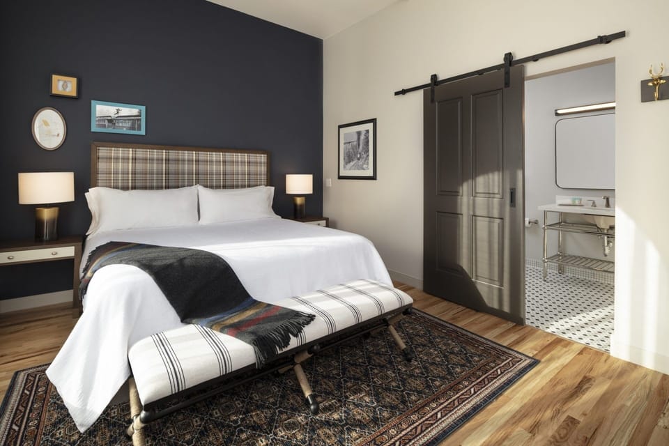 Sink into crisp linens and unwind in boutique comfort.