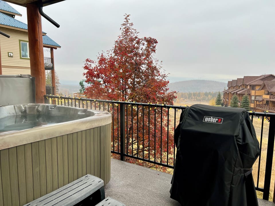 Your private covered Hot Tub and BBQ deck. Views of the Rocky Mountains and the Owl T-Bar.