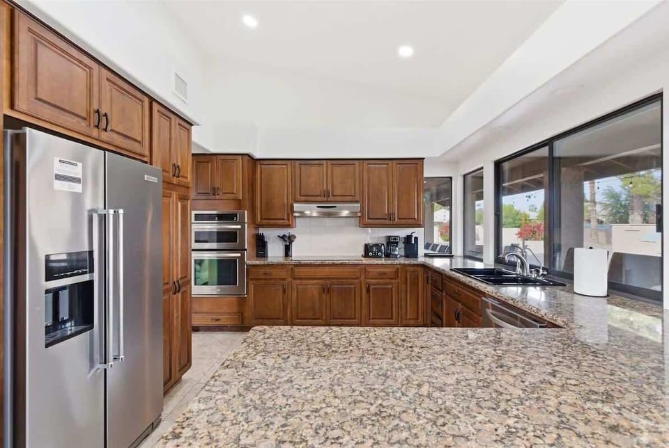 Fully equipped kitchen with stainless steel appliances and plenty of counter space for easy meal prep.