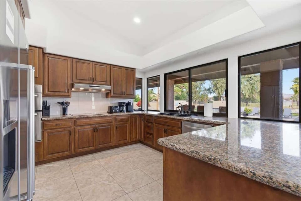 Fully equipped kitchen with stainless steel appliances and plenty of counter space for easy meal prep.