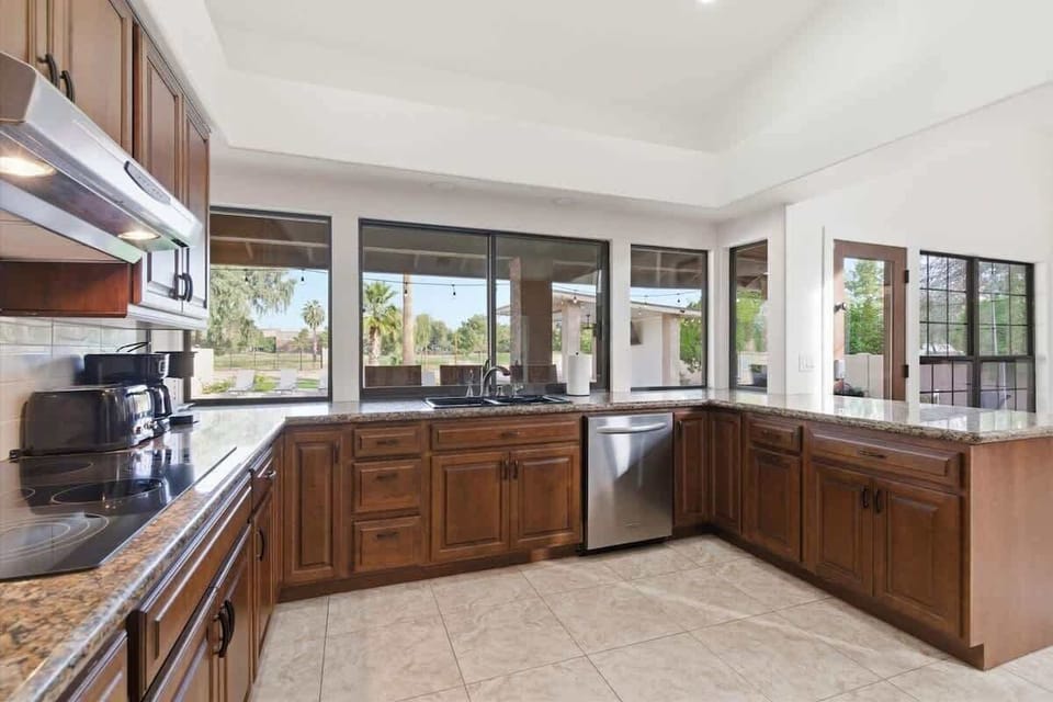 Fully equipped kitchen with stainless steel appliances and plenty of counter space for easy meal prep.