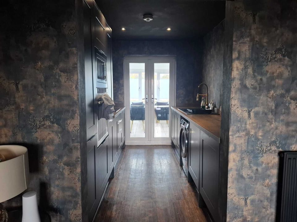 Elegant Kitchen leading through to conservatory/dining area