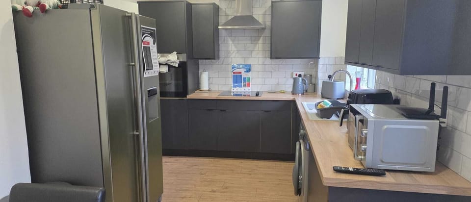 Functional kitchen with modern appliances - save money by cooking your own meals with full-size fridge and all cooking essentials