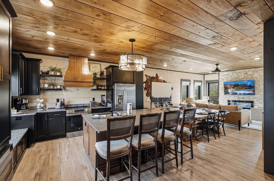 Fully equipped gourmet kitchen with stainless appliances