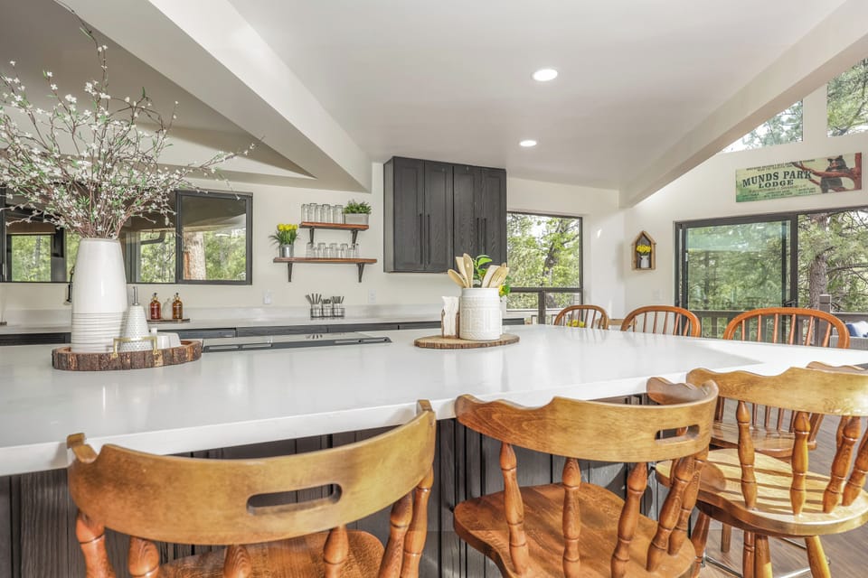 The oversized kitchen island is where the best moments happen—from pancake breakfasts and afternoon snacks to wine, charcuterie, and conversations that last long into the evening. It's the perfect gathering place for your group.