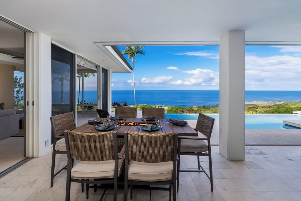 Dine al fresco at your elegant outdoor table, where ocean breezes and stunning sea views create the perfect backdrop for memorable meals.