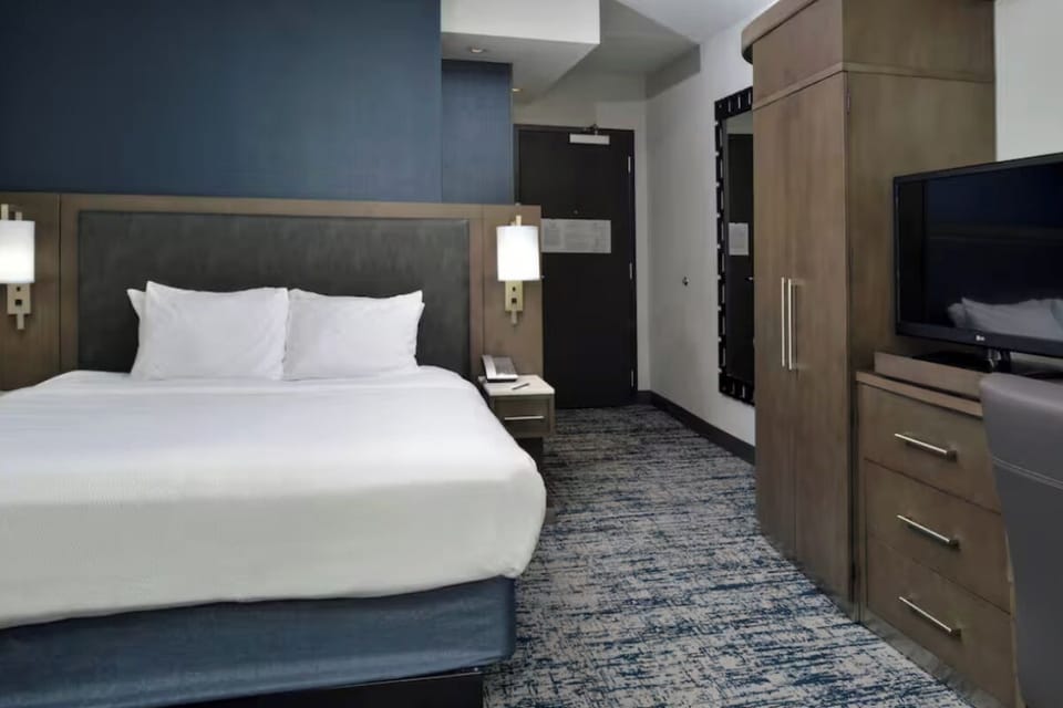 Settle in with a big TV and freshly made bed