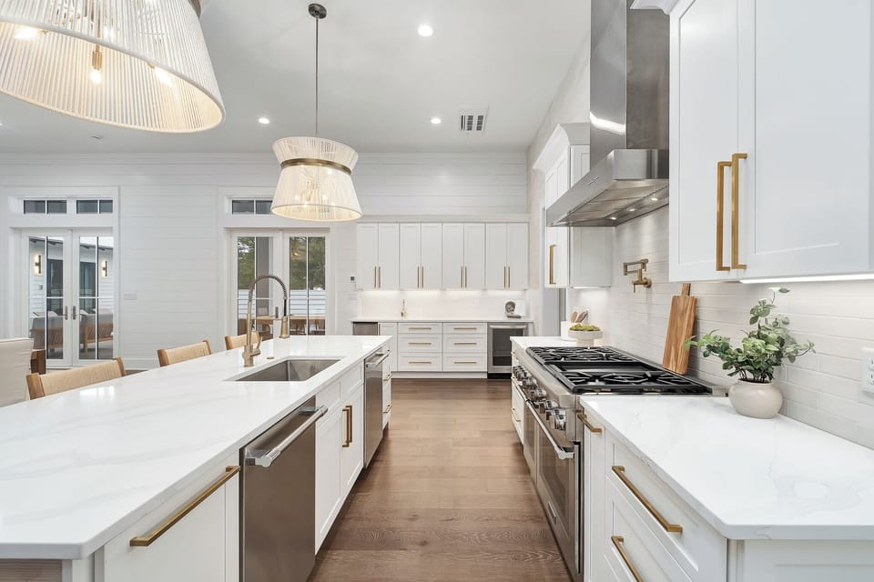Your gourmet kitchen awaits with marble countertops, brass accents, and premium appliances perfect for culinary adventures.