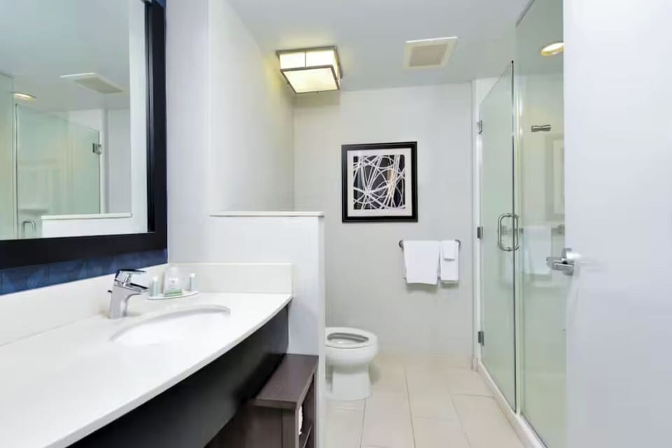 Refresh in a bright bathroom with a sleek glass shower