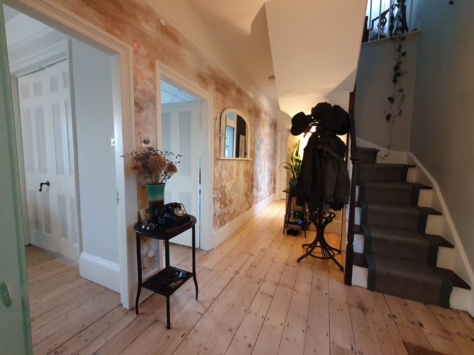 Entrance hallway with stairs to upstairs bedrooms