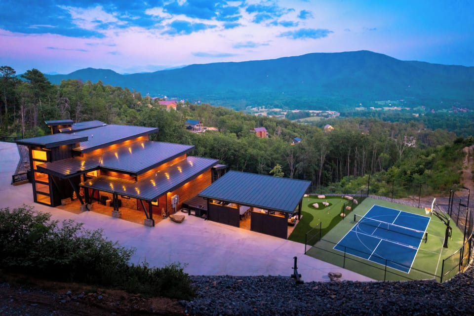 Modern mountain retreat with expansive mountain views and private sports court