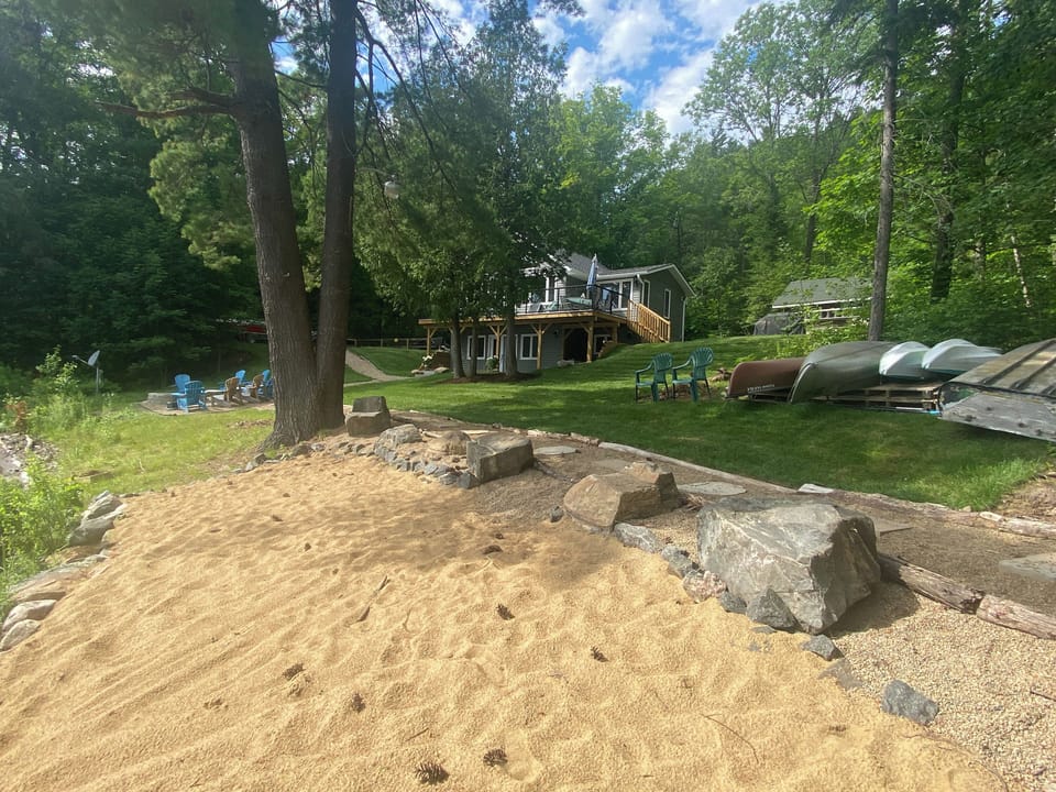 Sandy beach and walkway leading up to cottage