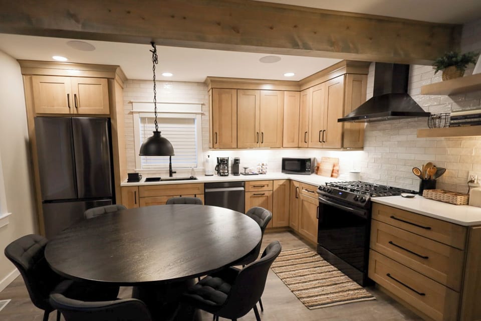 Fully stocked kitchen with microwave, air fryer, toaster and coffee station