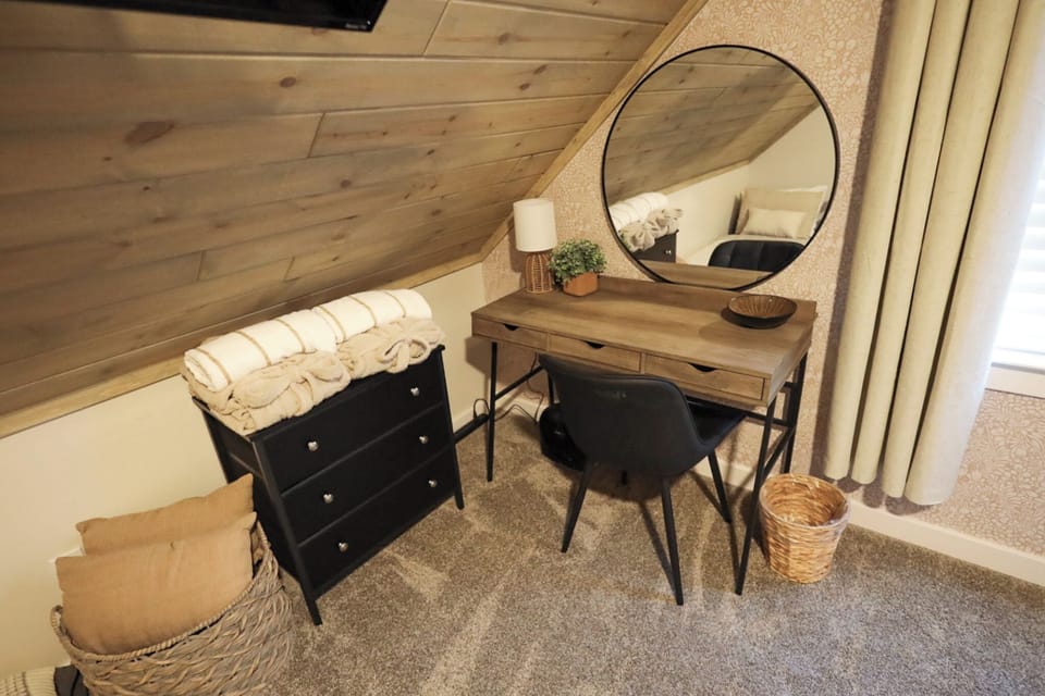 Upper level King bedroom with desk & reading chair that converts to single bed.