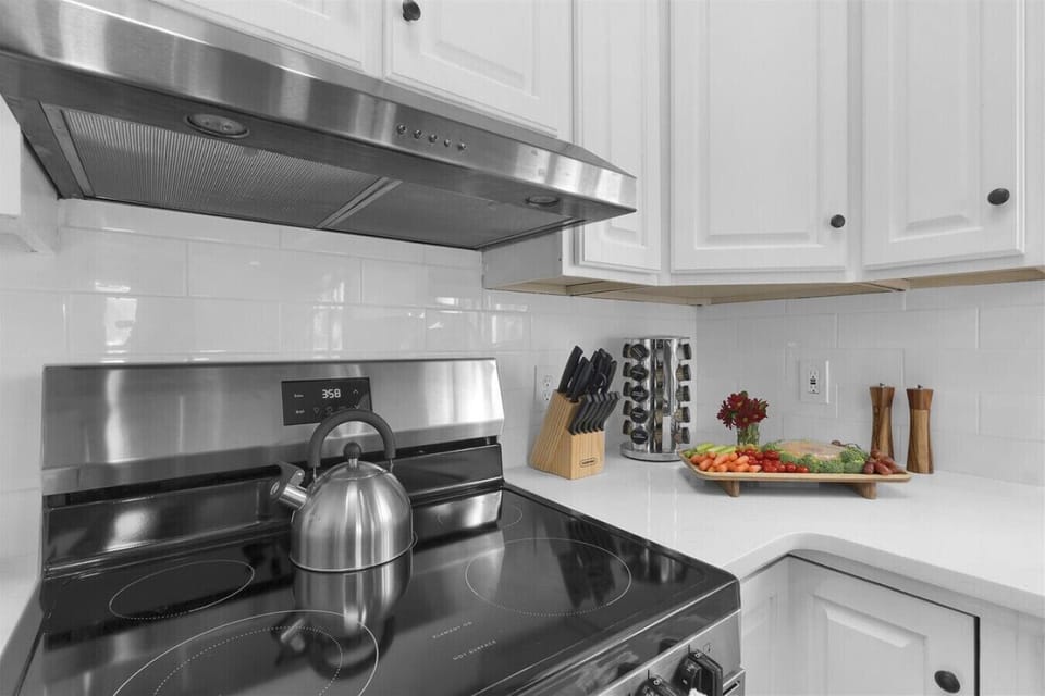 The kitchen features a large oven to make meal prep easy and convenient