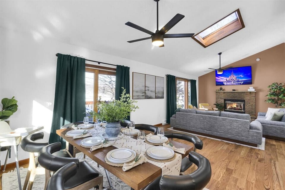 Sun-filled living and dining area with direct access to the deck—perfect for indoor-outdoor living.