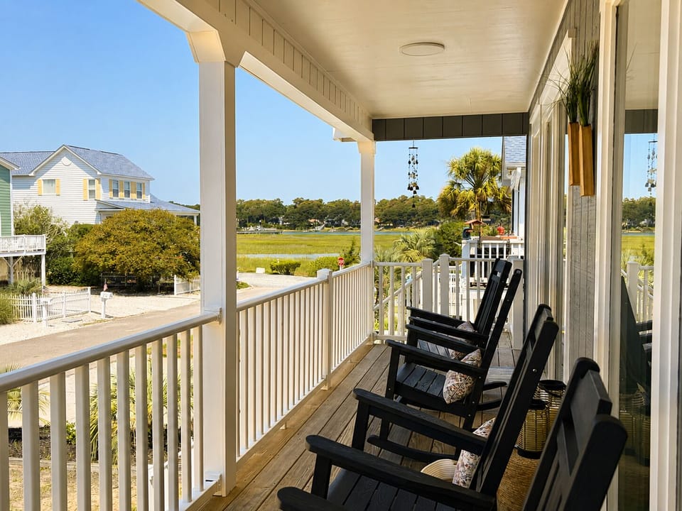 Watch high king tides roll over the marsh right from your porch rocking chairs.
