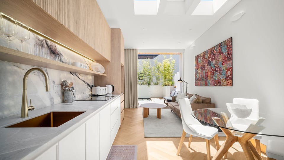 Modern open kitchen and dining space filled with natural light