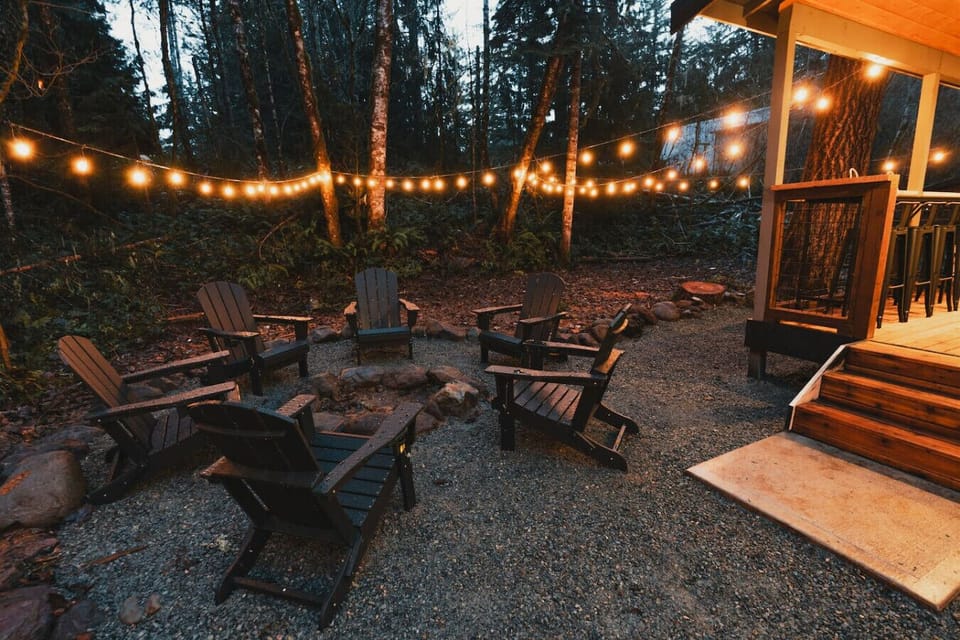 Firepit w/Adirondack Chairs - Evening fire pit with rope lighting sets the mood for s’mores, laughter, and memories.