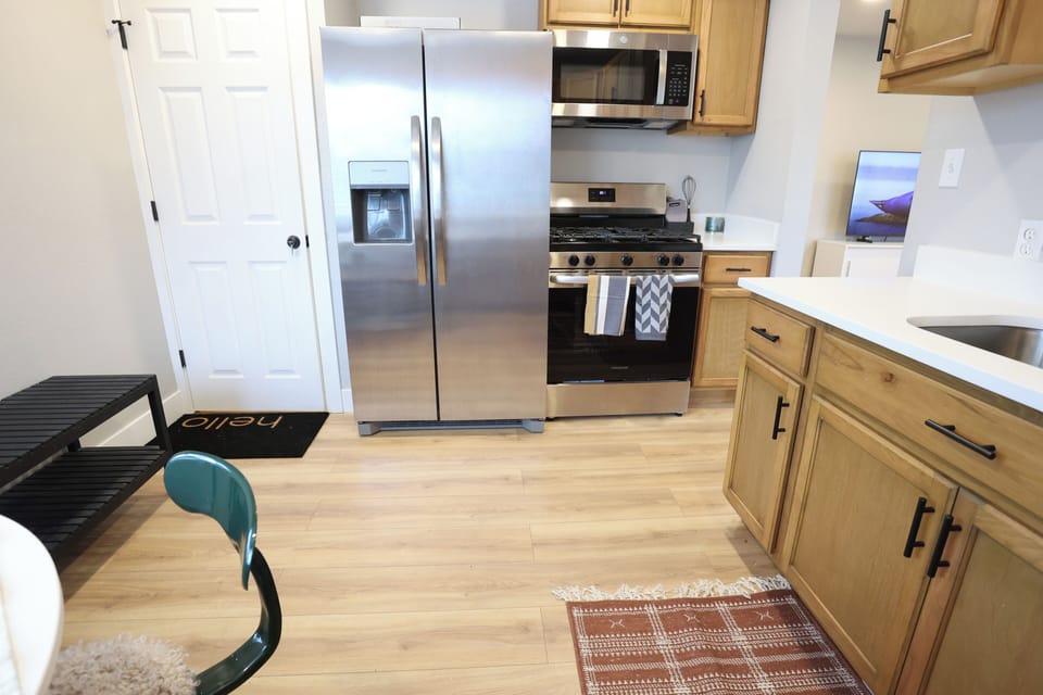 Gas range, full size oven and fridge.