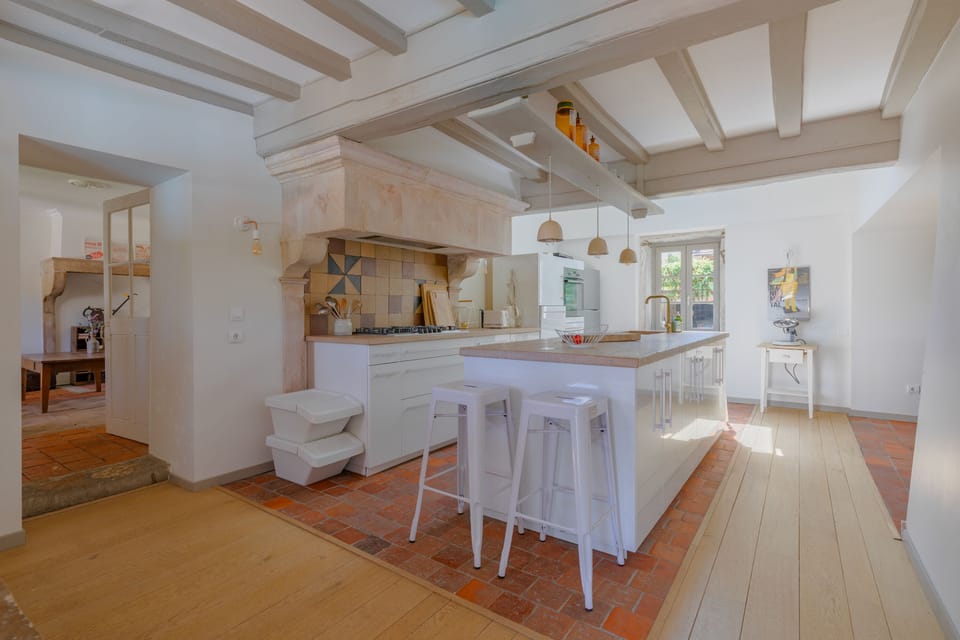Large, fully equipped kitchen with access to the dining room and terrace.