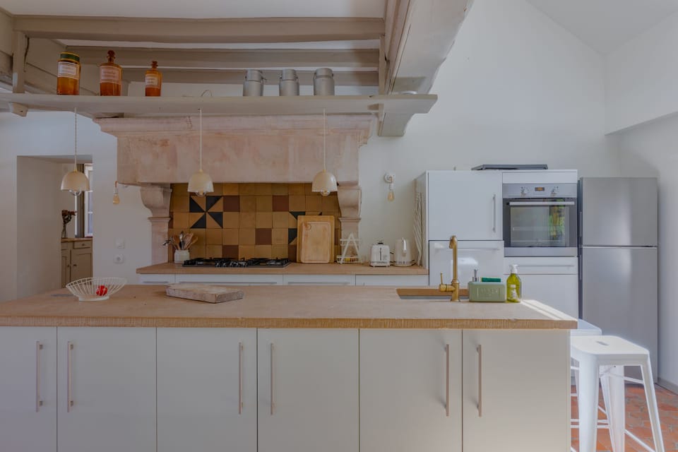 Large, fully equipped kitchen with access to the dining room and terrace.