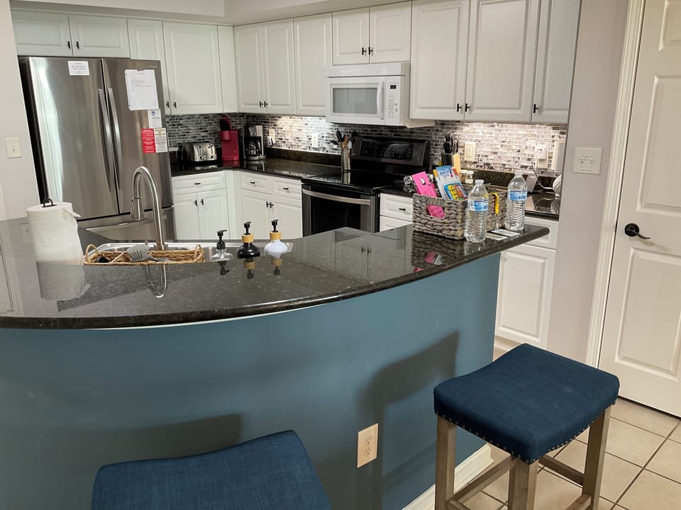 Kitchen bar with two bar stools for extra seating