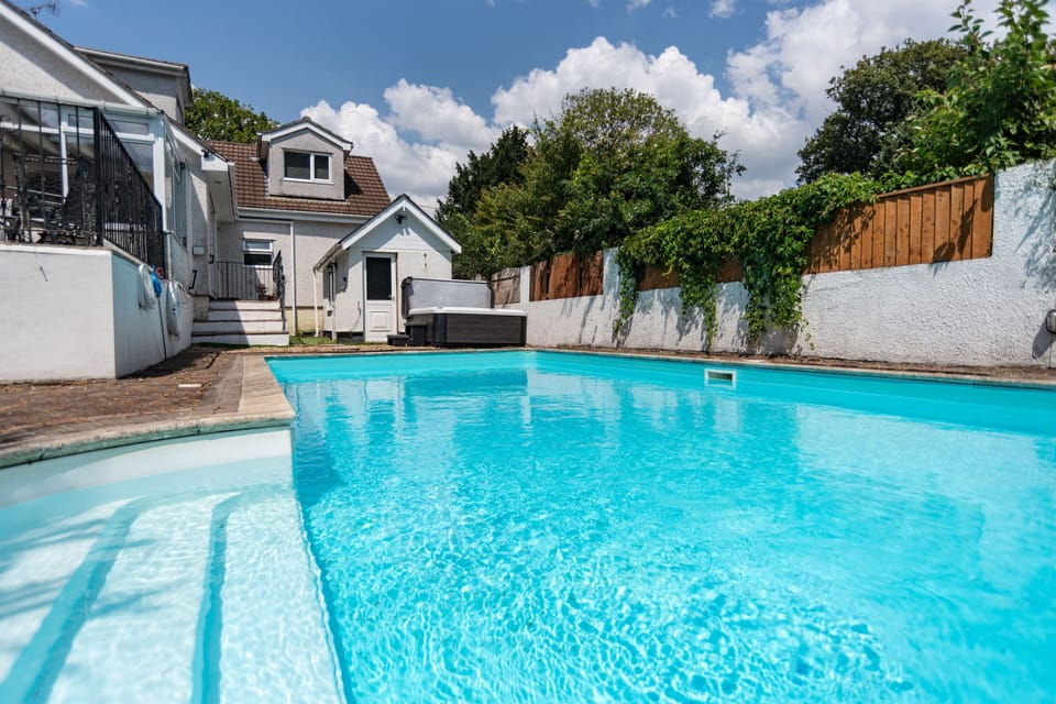 Take a refreshing dip in the private outdoor heated swimming pool, perfect for relaxing throughout your stay.