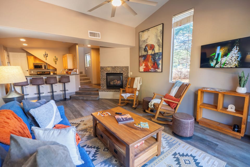 Sink into the cozy sofa and watch your favorite shows on the flat-screen TV while the fireplace warms your evening retreat.