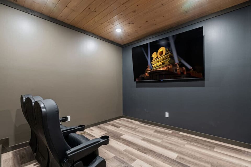 Settle in for movie night with theater-style seating and a huge screen—your own private cinema experience in the mountains.