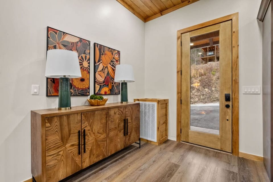 Step through the front door and into a cozy, welcoming space where warm woods, modern finishes, and thoughtful details set the tone for your stay.