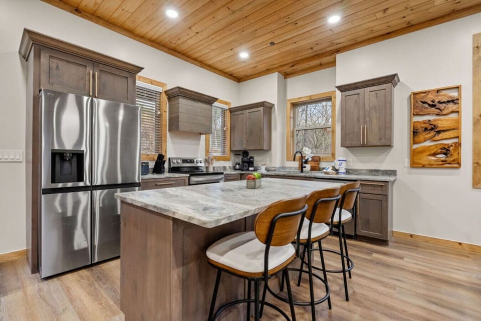 This stylish kitchen is built for more than just cooking—it`s where pancake mornings and late-night snacks turn into shared stories and belly laughs.